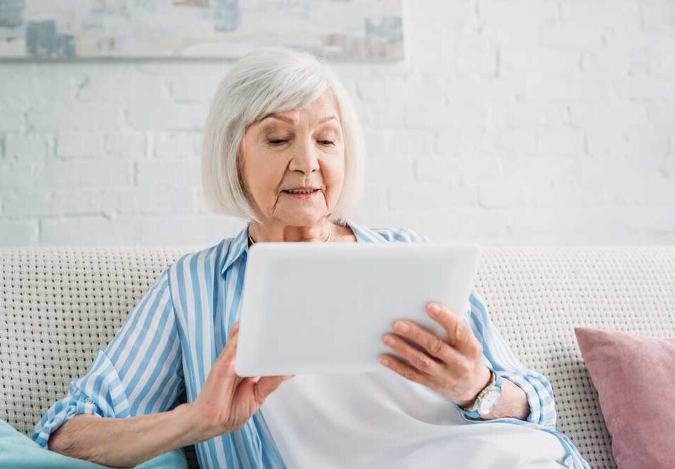 a senior lady using tablet