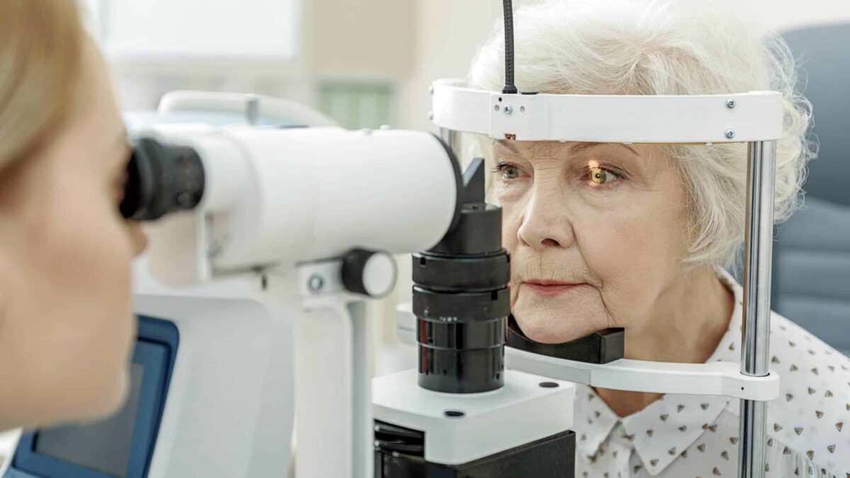 an elderly woman getting her eyes tested
